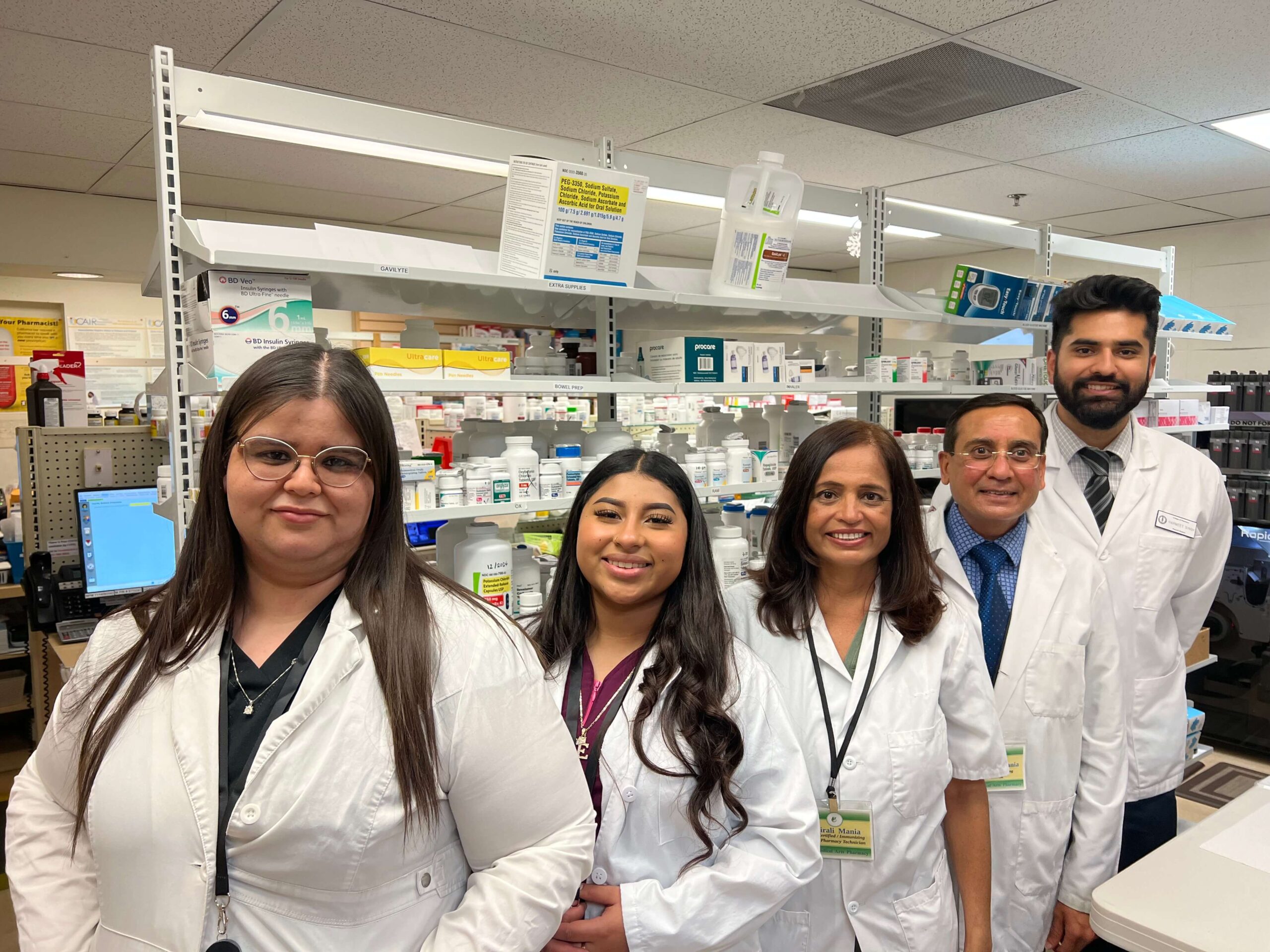 a group photo of 5 pharmacist